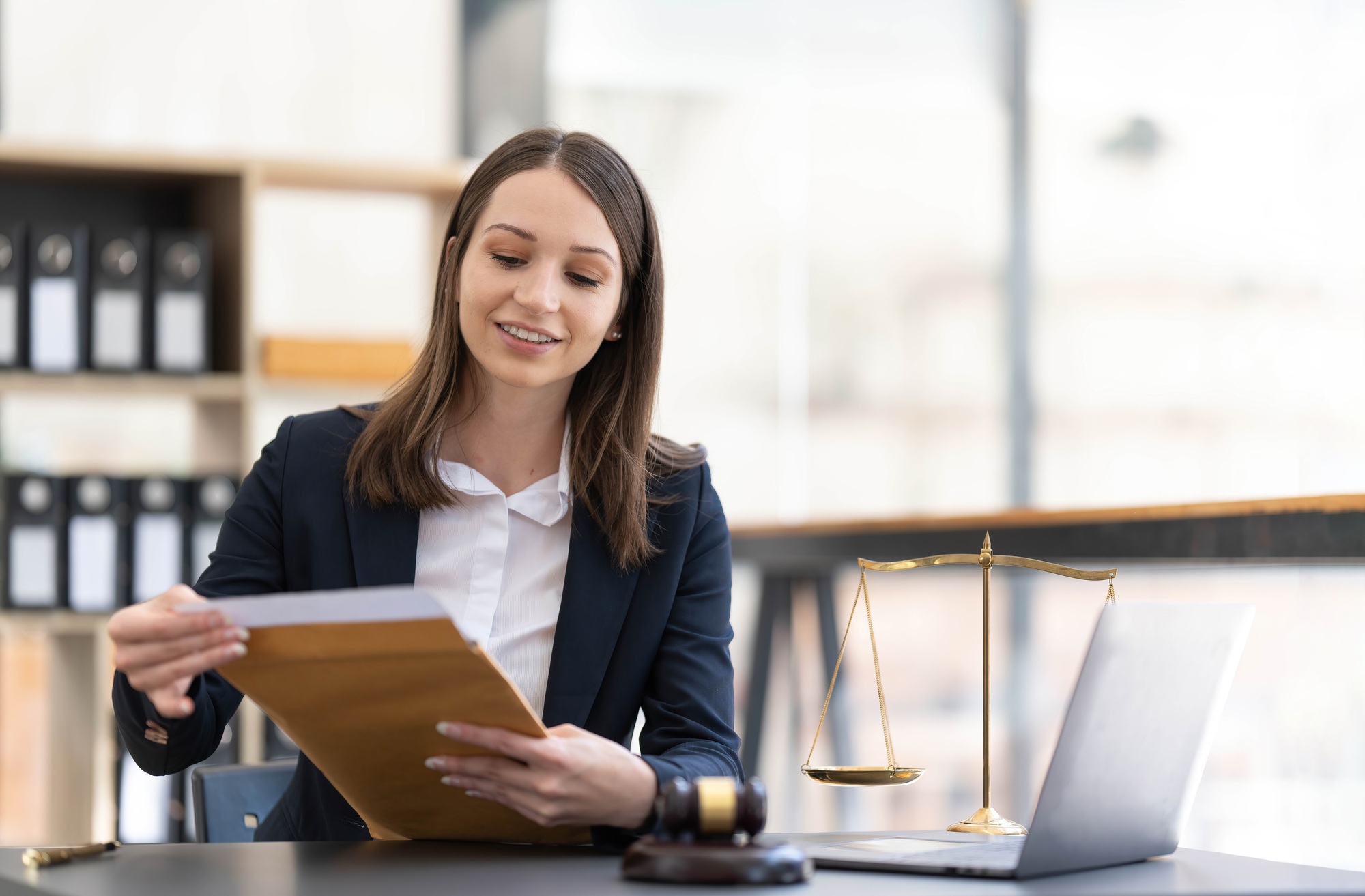 Justice Attorney's Office with Scales and Female Lawyer Working on Laptop, Advice and Justice Lawyer